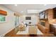 Stylish living room with brick fireplace and adjacent kitchen at 3524 Johnny Cake Ln, Charlotte, NC 28226