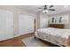 A bright main bedroom features hardwood flooring and closet space at 3524 Johnny Cake Ln, Charlotte, NC 28226