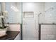 Modern glass shower with white subway tile and decorative accents at 3524 Johnny Cake Ln, Charlotte, NC 28226