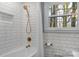 Bright bathroom shower with white subway tile and gold shower head at 3524 Johnny Cake Ln, Charlotte, NC 28226