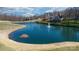 Aerial view of a neighborhood pond with a fountain, surrounded by golf course and residential properties at 3730 Club House Ne Dr, Conover, NC 28613