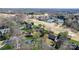 Aerial view showcasing a beautiful golf course community with lush greenery and well-maintained homes at 3730 Club House Ne Dr, Conover, NC 28613