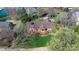 Aerial view of a beautiful home with a spacious deck, lush lawn, and mature trees at 3730 Club House Ne Dr, Conover, NC 28613