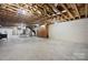 Unfinished basement with exposed ceiling and concrete flooring ready for customization at 3730 Club House Ne Dr, Conover, NC 28613