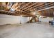 Unfinished basement with exposed ceiling and concrete flooring ready for customization at 3730 Club House Ne Dr, Conover, NC 28613