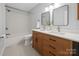 Modern bathroom featuring a double vanity, granite counters, and a shower/tub combo at 3730 Club House Ne Dr, Conover, NC 28613