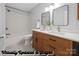 Updated bathroom with a double vanity, modern fixtures, and a combined bathtub and shower at 3730 Club House Ne Dr, Conover, NC 28613