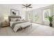Bright bedroom with neutral tones, a queen bed, an en suite, and lots of natural light at 3730 Club House Ne Dr, Conover, NC 28613