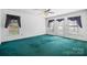 Spacious bedroom featuring large windows, a ceiling fan, and carpeting at 3730 Club House Ne Dr, Conover, NC 28613