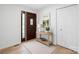 Welcoming entryway features a wooden door, light wood floors, and a console table with decor at 3730 Club House Ne Dr, Conover, NC 28613
