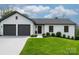 Charming, freshly painted home with a two-car garage, manicured lawn, and updated landscaping at 3730 Club House Ne Dr, Conover, NC 28613