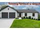 Charming home with modern curb appeal, featuring a two-car garage and manicured lawn at 3730 Club House Ne Dr, Conover, NC 28613