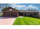 Well-kept brick home with double garage and tidy landscaping, ready for new owners at 3730 Club House Ne Dr, Conover, NC 28613
