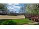 Scenic view of a lush golf course from a home's yard, featuring mature trees and well-manicured landscaping at 3730 Club House Ne Dr, Conover, NC 28613
