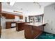 Classic kitchen with wood cabinets, an island with a countertop, and adjacent casual dining area at 3730 Club House Ne Dr, Conover, NC 28613