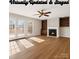 Inviting living room boasts a fireplace, built-in shelving, and sun-filled French doors at 3730 Club House Ne Dr, Conover, NC 28613