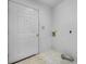 The mud room features a white door and tile flooring at 3730 Club House Ne Dr, Conover, NC 28613