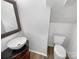 Chic bathroom featuring an elegant vanity sink, mirror, and a modern toilet at 3914 Hathaway Hills Dr, Charlotte, NC 28214