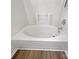 A pristine white bathtub with a tile surround, perfect for relaxation and comfort at 3914 Hathaway Hills Dr, Charlotte, NC 28214