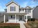 Charming two-story home with a covered front porch and inviting curb appeal at 3914 Hathaway Hills Dr, Charlotte, NC 28214