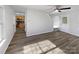 Bright living room with wood-look flooring and a view to the kitchen at 3914 Hathaway Hills Dr, Charlotte, NC 28214
