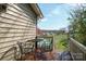 Cozy deck with table and chairs that overlooks a beautiful yard and country landscape at 409 Cardinal Dr, Newton, NC 28658