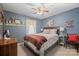 Charming bedroom with blue wallpaper, a ceiling fan and quaint decor at 409 Cardinal Dr, Newton, NC 28658