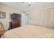 Sunlit bedroom with a ceiling fan, neutral paint, and closet space at 409 Cardinal Dr, Newton, NC 28658