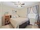 Bright bedroom featuring a ceiling fan and built in shelves for storage at 409 Cardinal Dr, Newton, NC 28658