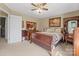 Spacious bedroom with a ceiling fan and matching wood furniture at 409 Cardinal Dr, Newton, NC 28658