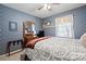 Stylish bedroom with a ceiling fan and matching wooden furniture at 409 Cardinal Dr, Newton, NC 28658