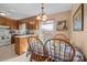 Charming dining area features a table set for four, bathed in soft natural light at 409 Cardinal Dr, Newton, NC 28658