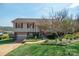 Well-maintained two-story home featuring a brick foundation, attached garage and manicured lawn at 409 Cardinal Dr, Newton, NC 28658