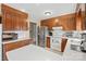 Classic kitchen with wooden cabinets, stainless steel appliances and a bright white backsplash at 409 Cardinal Dr, Newton, NC 28658