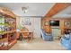 Comfortable living room with wood paneled wall, wet bar and cozy seating area at 409 Cardinal Dr, Newton, NC 28658