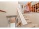 Inviting carpeted staircase leading to the upper level with natural light at 409 Cardinal Dr, Newton, NC 28658