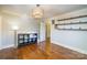Neutral bedroom featuring hardwood floors, shelving, and large window at 412 W D Ave, Salisbury, NC 28144