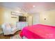 Bright bedroom with a dresser, TV, rocker chair, large window and a ceiling fan at 412 W D Ave, Salisbury, NC 28144