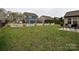 Large backyard with a well-maintained lawn and a white picket fence for added privacy at 4425 Marlay Park, Indian Trail, NC 28079