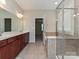 Bathroom features double sinks, tiled floor, and a separate tiled shower enclosure at 4425 Marlay Park, Indian Trail, NC 28079