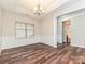 Elegant dining area featuring hardwood floors, wainscoting, and an adjacent room with a bathroom at 4425 Marlay Park, Indian Trail, NC 28079