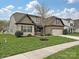 Charming two-story home with a well-manicured lawn, tree, and attached two car garage at 4425 Marlay Park, Indian Trail, NC 28079