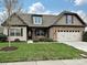 Attractive home showcasing a well-kept lawn, attached two-car garage, and stylish architectural details at 4425 Marlay Park, Indian Trail, NC 28079