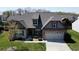 Charming home featuring a two-car garage, manicured lawn, and elegant brick and siding accents at 4425 Marlay Park, Indian Trail, NC 28079