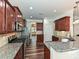 Modern kitchen with stainless steel appliances, granite countertops, and hardwood floors at 4425 Marlay Park, Indian Trail, NC 28079