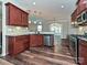 Kitchen with stainless steel appliances, granite countertops, wood cabinets, and hardwood floors at 4425 Marlay Park, Indian Trail, NC 28079
