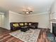 Cozy living room showcasing a fireplace, plush sofa with decorative pillows, and an ornate area rug at 4425 Marlay Park, Indian Trail, NC 28079
