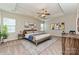 Spacious bedroom featuring a ceiling fan, neutral-toned walls, a tray ceiling, and cozy carpet flooring at 4425 Marlay Park, Indian Trail, NC 28079