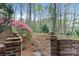 Beautiful backyard garden with a variety of colorful plants and stone walkway at 5125 Winding Brook Rd, Charlotte, NC 28226