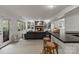 Entertain in this finished basement featuring a fireplace, built in shelving, and a bar with seating at 5125 Winding Brook Rd, Charlotte, NC 28226